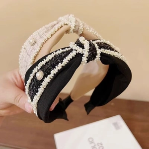 Elegant tweed knot headband with pearl embellishments for an elevated autumn winter look
