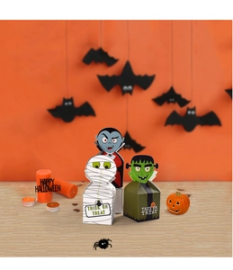 Halloween candy boxes featuring vampire and mummy characters in a festive party setting