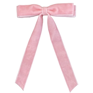 Pink velvet hair clip with elegant long ribbons and French bow tie design on white background