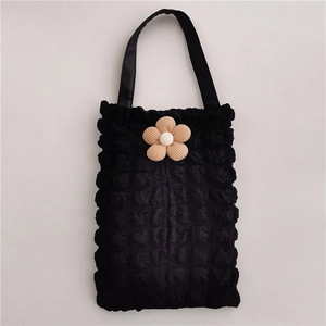 Detail of black popcorn fabric car tissue box bag with a cream floral accent