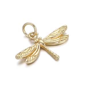 Detailed view of a golden dragonfly pendant with textured wings and a round hanging loop