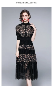 Detail of black lace dress with beige polka dot bands and eyelash lace hemline