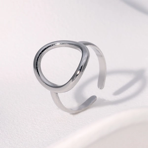 Detailed side view of silver geometric open ring with adjustable minimalist metal band