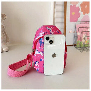 Pink cartoon unicorn mini backpack shown with phone for size comparison and detail
