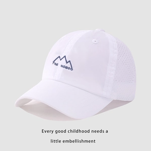 Detail of white mesh baseball cap featuring mountain embroidery and breathable fabric