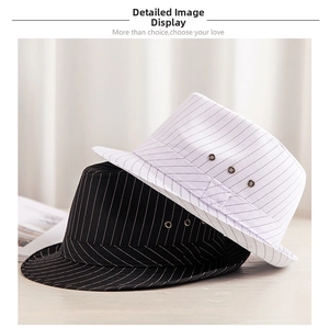 Detail of black and white fedora hats with pinstripe bands and metal ventilation holes