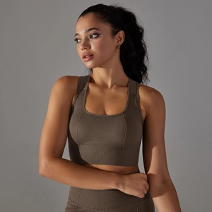 Detail of seamless knitted sports bra and leggings set with breathable mesh texture