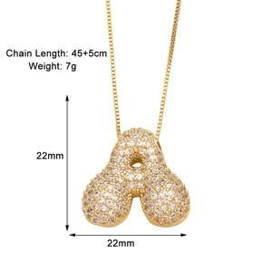 Detail view of gold letter A pendant necklace with size 22mm and length 45+5cm specs