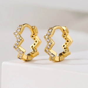 Elegant 18K gold plated wavy hoop earrings with clear cubic zirconia stones on white stand