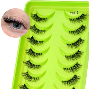 Macro detail of dense black synthetic fiber half lashes on green tray model YK313