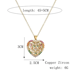 Detail view of heart-shaped tree of life necklace with dimensions and material specs