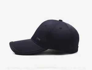 Detail view of navy baseball cap with metal CHINA lettering and fine black brim edging