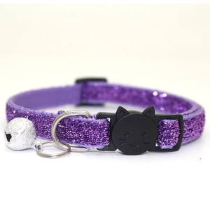 Sparkly purple cat collar with safety buckle and silver bell on a clean white background