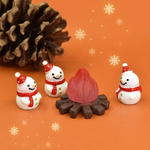 Christmas miniature resin set featuring three snowmen and a campfire for holiday decor