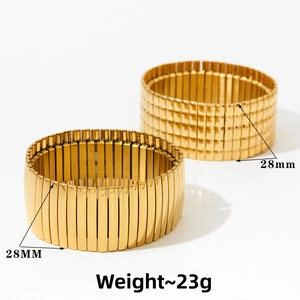 Detail view of gold-plated stretch bracelet showing 28mm width and 23g weight specs