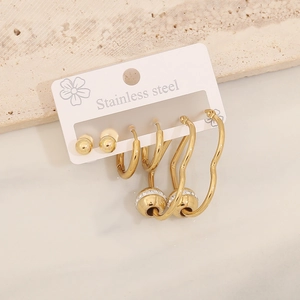 Detailed set of golden stainless steel heart earrings and studs on display card