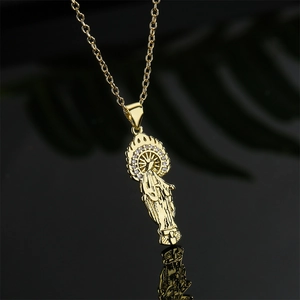 Gold plated religious necklace with zircon micro-inlay pendant on black background