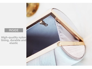 Internal view of evening clutch bag showing durable nylon lining and gold frame details