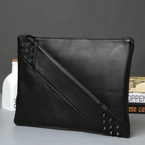 Black leather clutch bag with diagonal stitching and punk style metal rivet accents