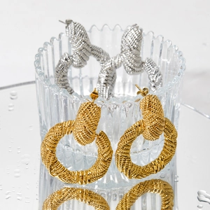 Fashion geometric stainless steel hoop earrings in gold and silver finish on mirror