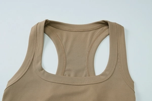 Close-up of neckline stitching on brown ribbed knit u-neck tank top with racerback design
