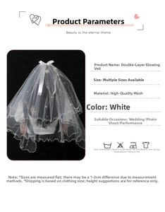 Detail of white double-layer glowing veil with LED lights and white bow decoration