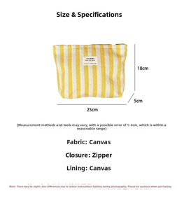 Detailed view showing dimensions and canvas material of the yellow striped makeup bag