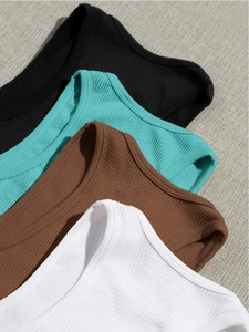 Close-up of ribbed nylon athletic tanks in black, blue, brown, and white colors