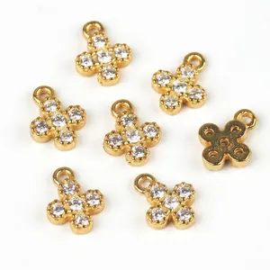 Set of seven gold plated star flower charms with clear cubic zirconia pavé stones