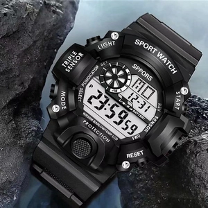 Waterproof tactical sport watch with digital display on wet rocks outdoors