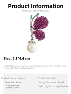 Detail of rose red rhinestone butterfly brooch with white pearl drop and alloy specs