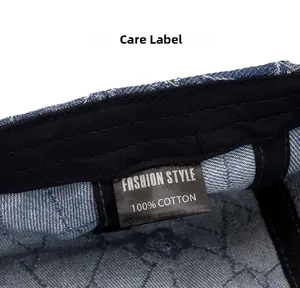Detailed view of denim beret interior featuring 100% cotton wash label and sweatband