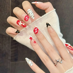 Star pattern and red lip relief press-on nails with zebra stripes and gold beads