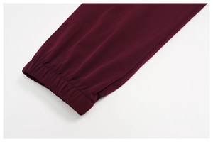 Detail of elastic cuff on dark purple sun protection sports suit with smooth texture