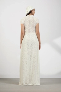 Rear view of long white lace cardigan dress featuring delicate hollowed-out patterns