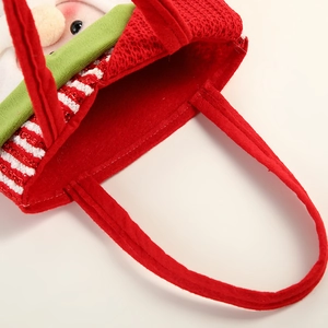 Red Christmas doll gift bag with green handles made of soft felt and knit fabric