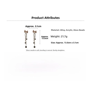Detail view of leopard bow earrings showing 13.8cm length and acrylic glass bead materials