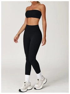 Close-up of black high-waisted yoga leggings and tube top made of elastic fabric