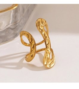 Detailed view of gold plated irregular hammer texture finish on minimalist steel ring