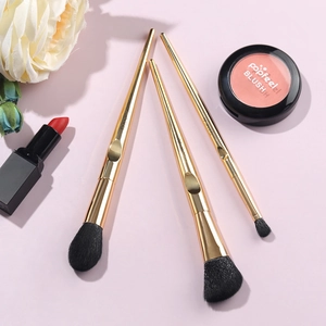 Golden tapered handle makeup brush set with black bristles for foundation and eyes