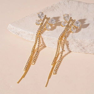 Macro detail of butterfly tassel earrings with gold plating and sparkling cubic zirconia
