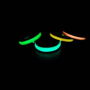 Luminous stainless steel rings set showing glowing green yellow and orange neon effects