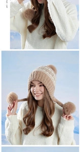 Detail of knitted winter earflap hat featuring pom-poms and warm Fair Isle pattern