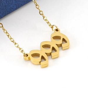 Golden 18K stainless steel 999 lucky number pendant necklace on white background