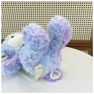 Rear view of purple gradient plush pig backpack with white straps on a desk