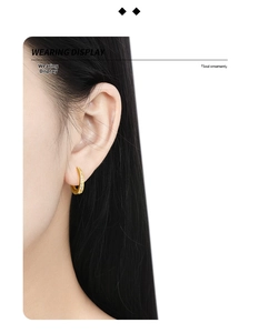 Close-up of minimalist gold S925 sterling silver hoop earring with micro-pave diamonds