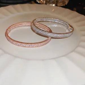 Luxury zircon bracelets in rose gold and silver with beaded edges on a white tray