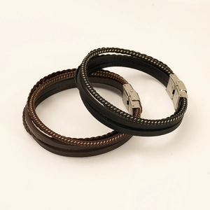 Detail of multilayer woven leather bracelets for men with stainless steel magnetic clasps