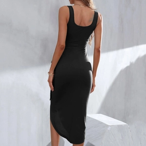 Detail view of the slim fit black midi dress showing the side slit and elegant back cut
