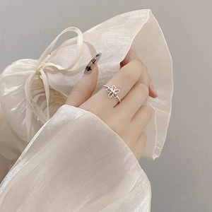 Minimalist S925 sterling silver open flower ring with hollow design on finger